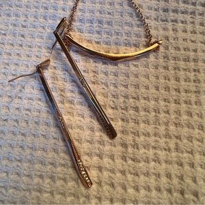 Kendra Scott rose gold and rhinestone slider bracelet and matching earrings.